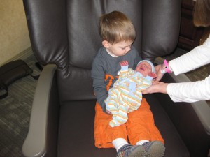 Cael holding Grair for the first time